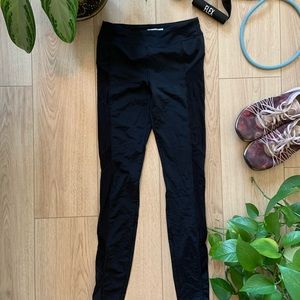 Black workout legging with mesh cut outs